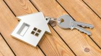 Nøgle og nøglering med bolig på 